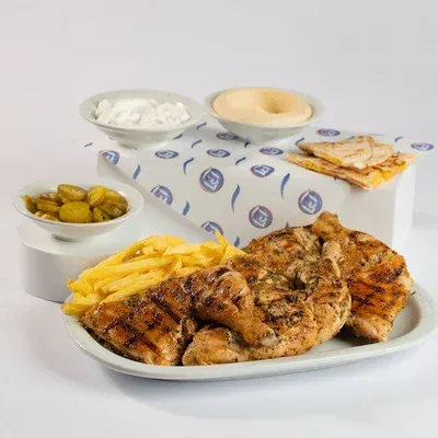Charcoal grilled chicken with hummus, garlic and fries